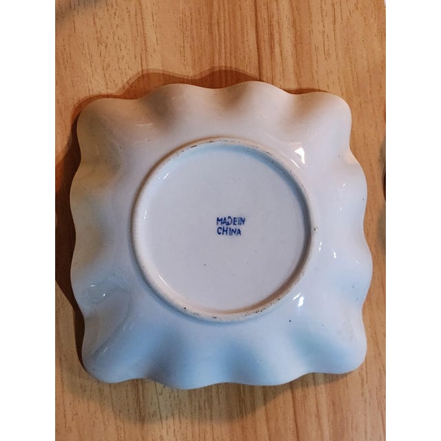 An elegant late 20th-century porcelain catchall or trinket dish featuring vibrant, stylized pink peony/rose blossoms...