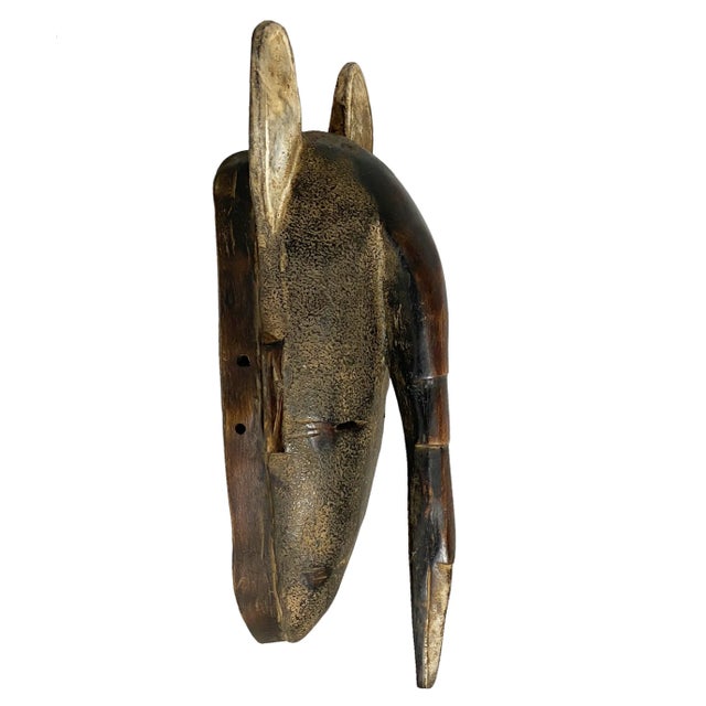 Superb hand sculpting of one piece of solid wood Baule Kpan tribe Ivory Coast . very geometric ,minimalist and artistic...