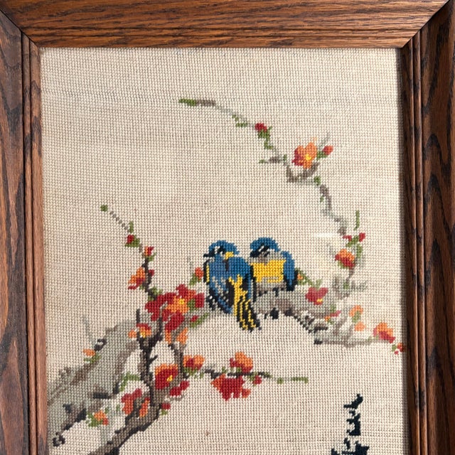 • Handmade Asian-inspired needlepoint textile wall art featuring two colorful birds perched among flowering branches. •...