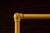 Vintage Industrial Pipe Rolling Garment Rack in Yellow For Sale In Chicago - Image 6 of 6