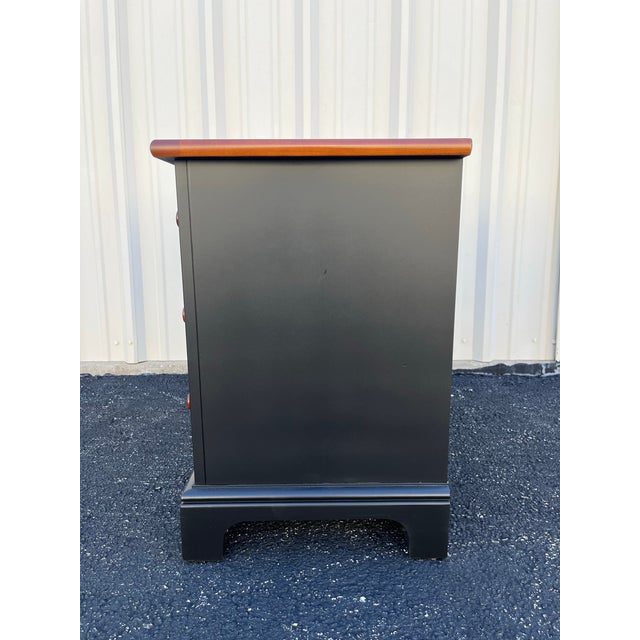 A pair of Stanley Furniture nightstands painted a beautiful satin black with natural, finished cherry top. Each nightstand...