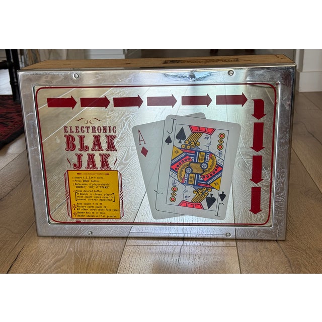 A fantastic vintage coin-operated electronic blackjack machine front panel in great condition. The chrome and wood casing...
