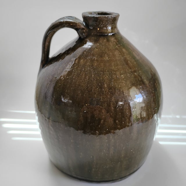This piece is a classic Charlie West buggy jug, handmade in Crawford County, Georgia. It features a traditional Southern...