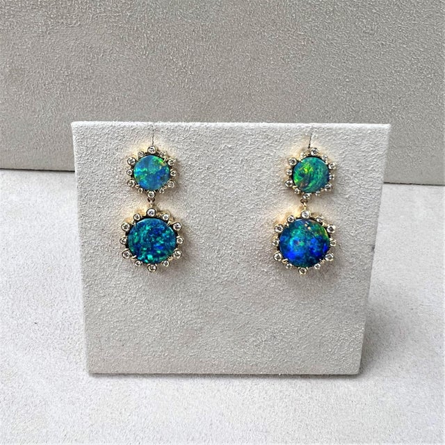 Created in 18 karat yellow gold Boulder Opal 9.70 carats approx. Diamonds 0.60 carat approx. Post back for pierced ears...