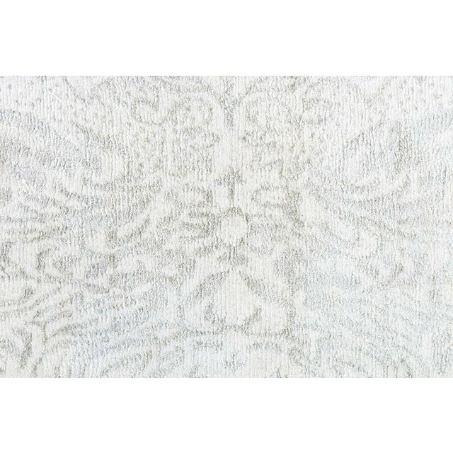 This modern traditional rug is an elegant fusion of timeless design and contemporary subtlety, hand-knotted in a luxurious...