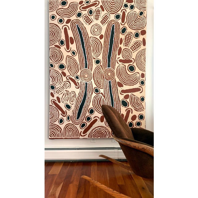 A large aboriginal painting by Ningura Napurrula (1938-2013). Title: "Rockhole Site of Wirrulnga" Artists: Ningura...