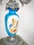Bring timeless French elegance to your mantel, dining table, or library with this striking pair of antique three-light...