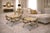 Offering a pair of vintage Italian rattan hand carved wood Spanish Empire benches, circa Late 20th Century. The design was...