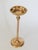 Vintage freestanding brass floor ashtray featuring a slender stem, a central node detail, and a round circular weighted...