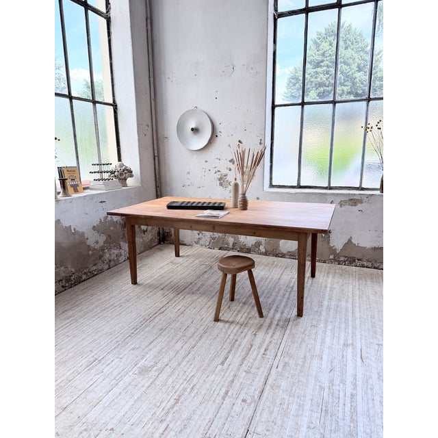 Antique large farmhouse table in pitch pine from the 1950s. we love its generous dimensions, with a depth of over one...