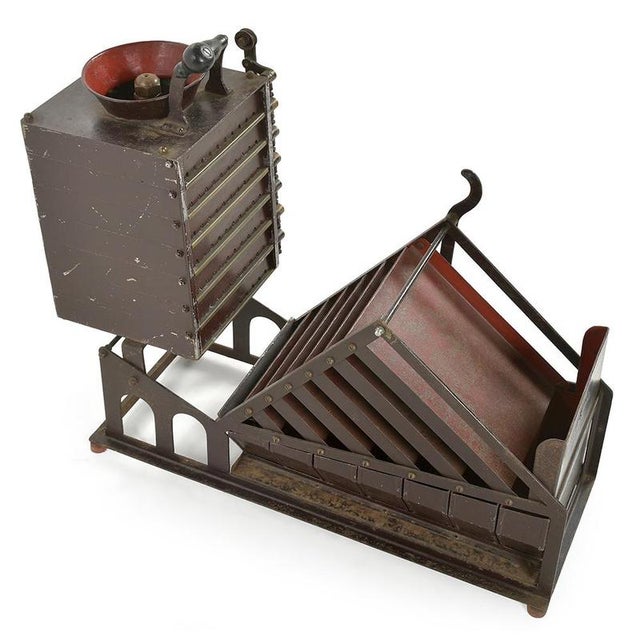 A rare and fascinating testament to the mechanical ingenuity of the early 20th century, this Belgian coin sorter is a...