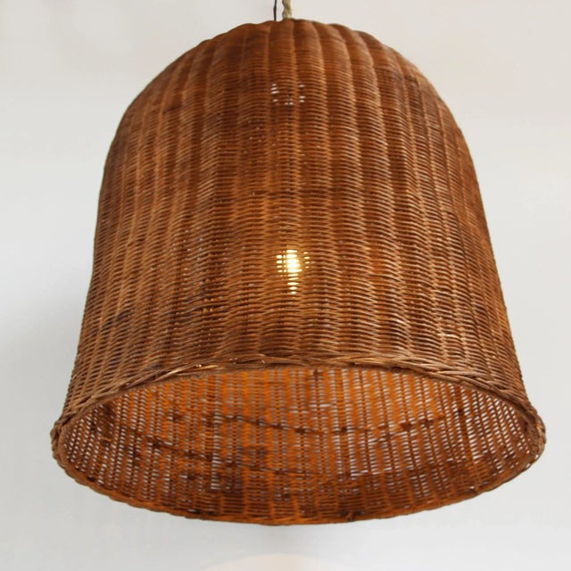 The wicker of this bell lantern was been stained a rich Coffee brown. Create a grouping with multiple lanterns or create a...