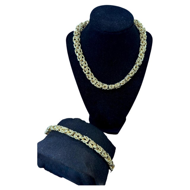 Vintage 14k Yellow Gold Woven Link Necklace and Bracelet Set. The necklace and bracelet are designed around a textured,...
