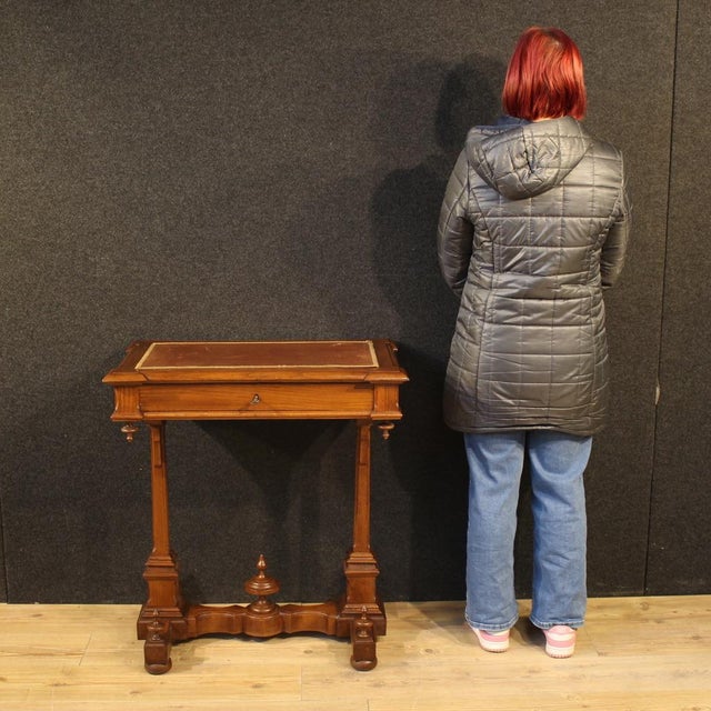 Italian writing table from the late 19th century. Carved chestnut wood, beautifully designed and attractively furnished....