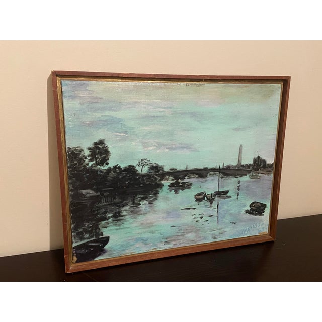 This vintage oil painting is a beautiful piece of art that features a canal scene. The painting is signed and produced in...