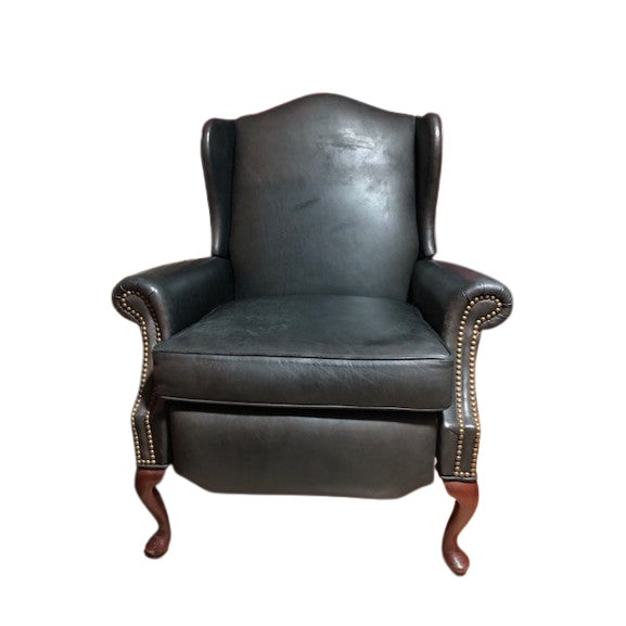 Experience the timeless elegance of the Pennsylvania House Motion leather Queen Anne Style Reclining Nailhead Armchair....