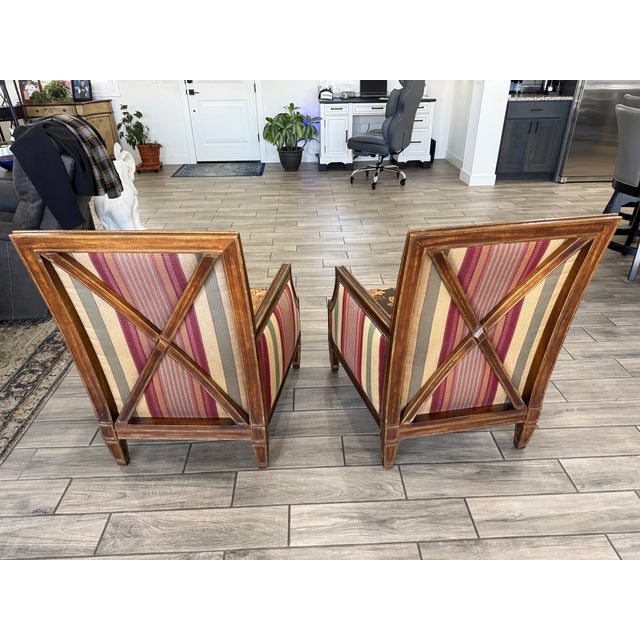 Gorgeous set of Wesley Hall armchairs. Upholstered with a pretty floral pattern on seat and front, stripes on back and...