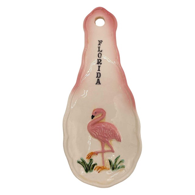 Mid-century Era pink and green 3d flamingo "Florida" ceramic spoon rest with a curious flamingo in the grass. The spoon...