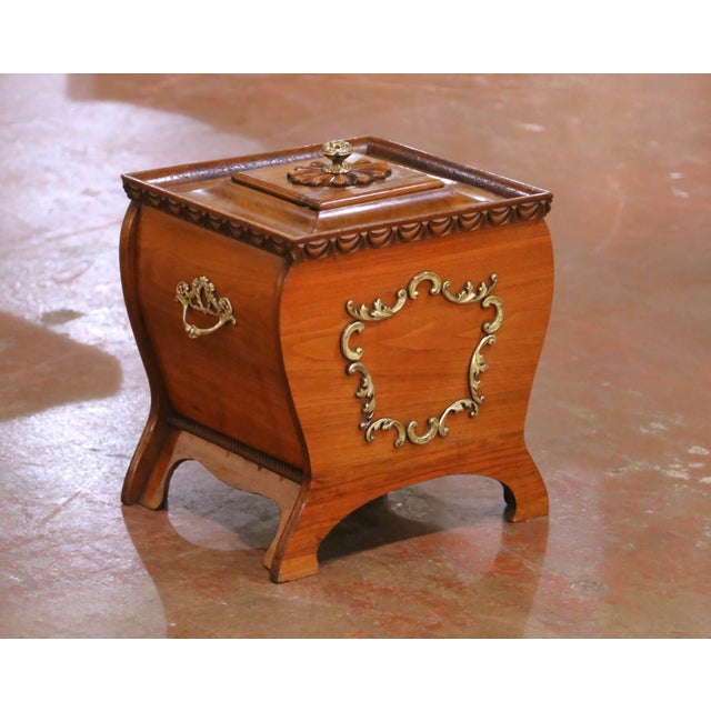 Decorate a hearth or fireside with this elegant antique coal scuttle. Crafted in France circa 1880, the bombe-form...