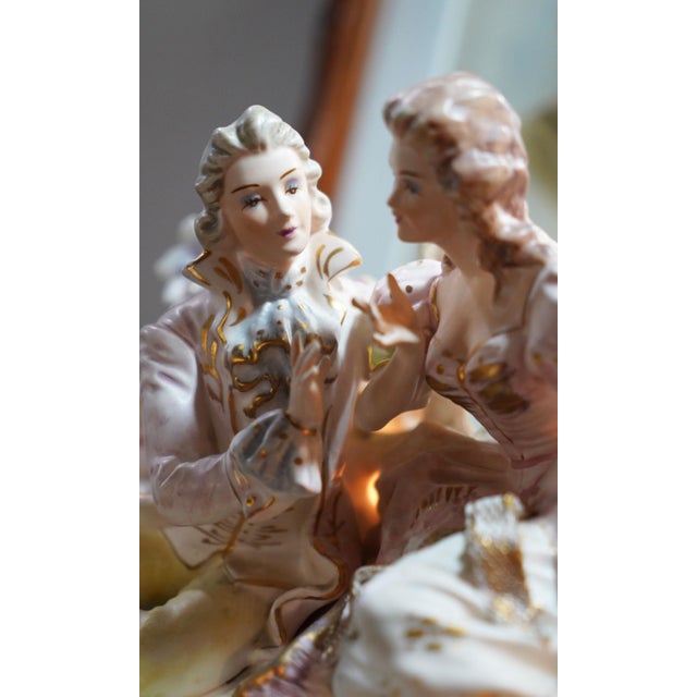 Darling vintage porcelain courting couple with exceptional detail throughout — soft blush tones, hand-painted gold trim,...