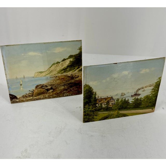 Danish Set of Two 19th Century Oil Painting Of Sailboats, Buildings, Coastline and Shoreline. They are unframed.