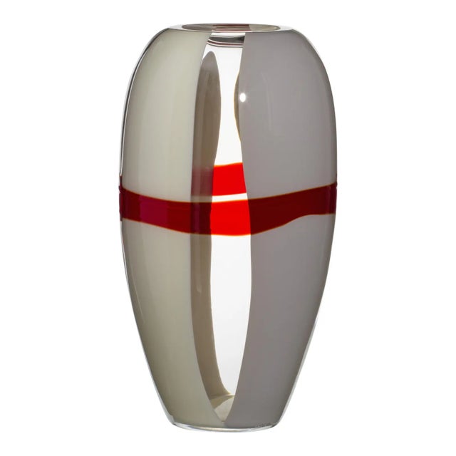 The elegance of simplicity. Ogiva is an axially symmetrical slender vase that catches your eye from every angle. The...