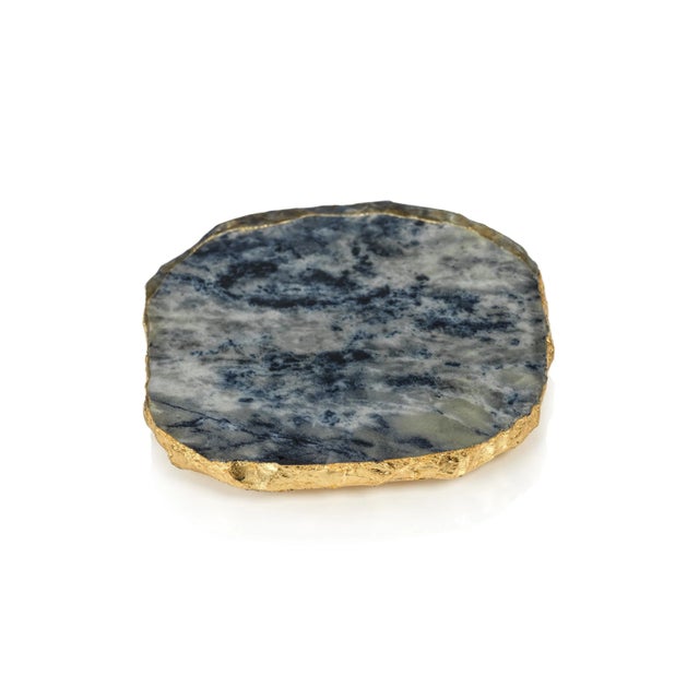 This elegant faux agate coaster set comes in varying colors and brings a slice of cultivated nature to the table. This...