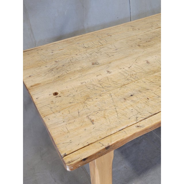 A rustic, beautiful antique Circa 1900 French worktable constructed out of pine that could be used as a dining table or in...