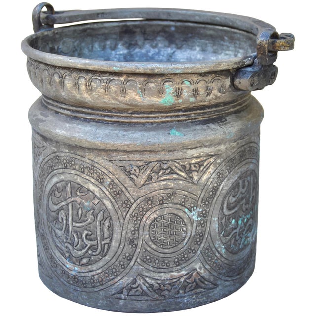 One-of-a-kind antique Moroccan bucket with handle, elegantly constructed of solid and very heavy metal, in an elegant...