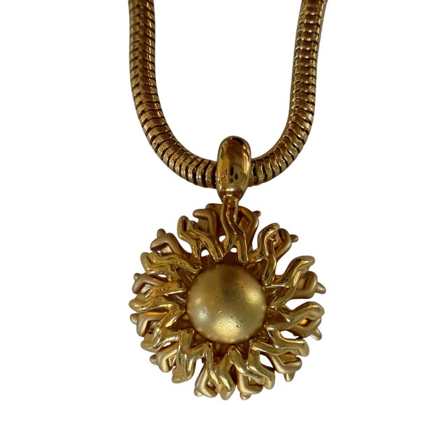 This is such a great vintage Monet necklace. Classic sun shaped pendant on simple chain is classic and timeless.