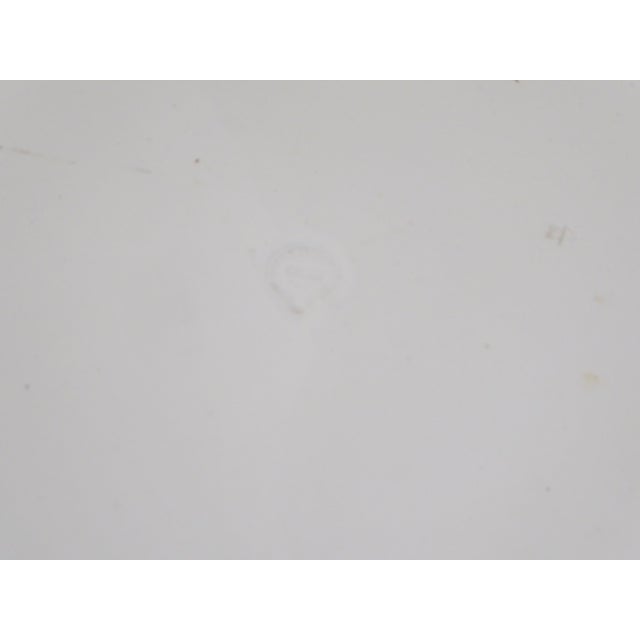 This antique ceramic platter of generous proportions, has old initials and is marked on the underside, though it is...