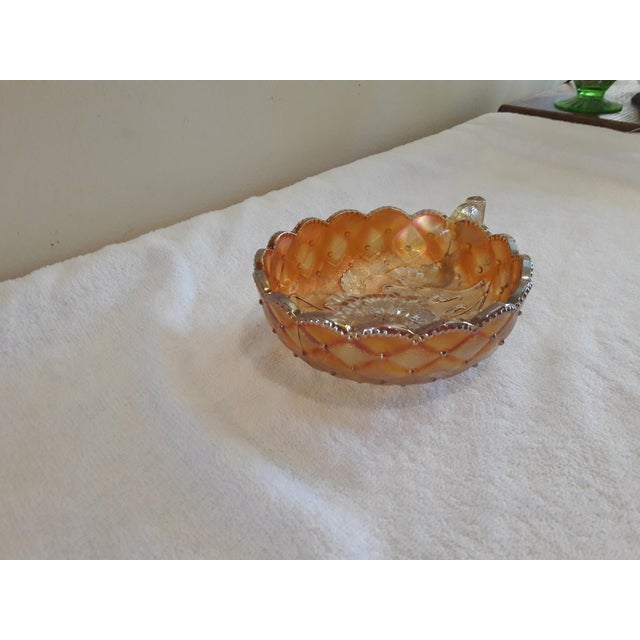 Vintage Marigold Quilted Diamond and Pansy Carnival Glass Iridescent Handle Bowl. Bowl is in excellent vintage condition...