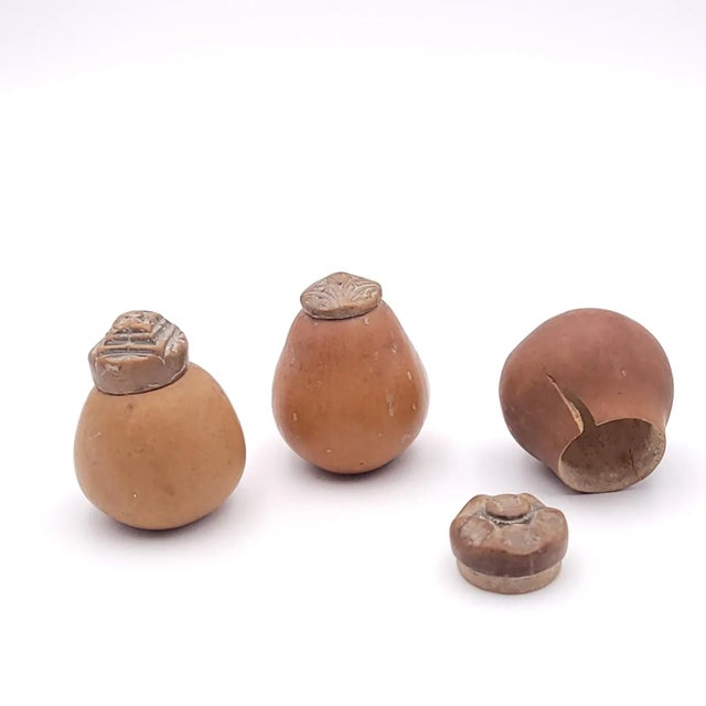 A group of three seed pod storage containers, probably Southeast Asia, 19th century.