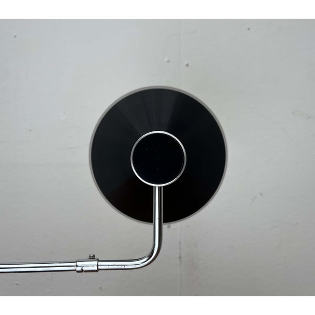 Minimalist table lamp by the Swiss manufacturer Baltensweiler, designed by Rosemarie and Rico Baltensweiler in the 1950s....