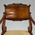 A fine Neoclassical armchair. Beautiful hardwood with carved details.