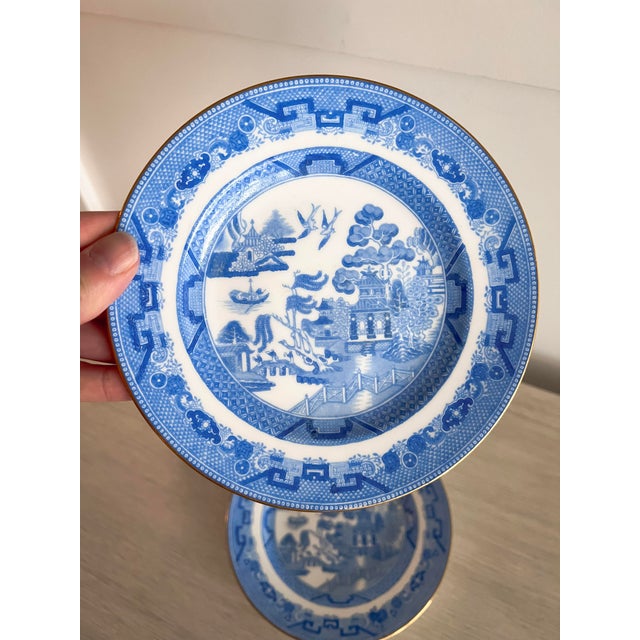 A refined set of two vintage Minton Blue Willow salad plates, crafted in England in the mid-20th century. These porcelain...