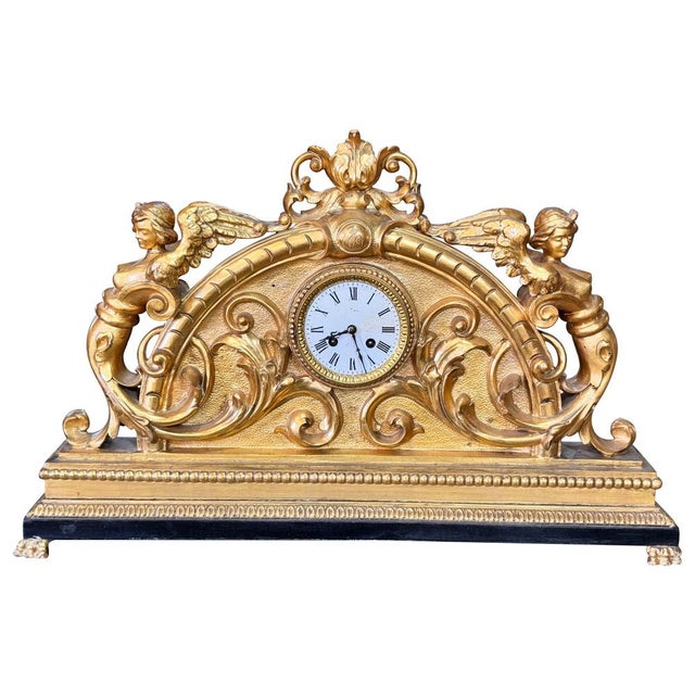Late Louis XV mantel clock, dated 1779 A magnificent 18th-century French mantel clock, dated 1779, crafted from carved and...