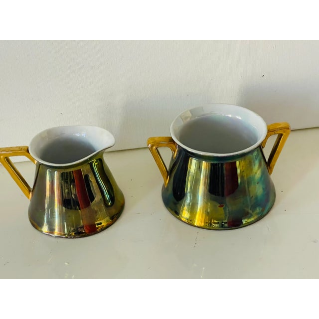 Antique Art Nouveau irridescent porcelain Loetz sugar pot and creamer. Rare collectible pieces.