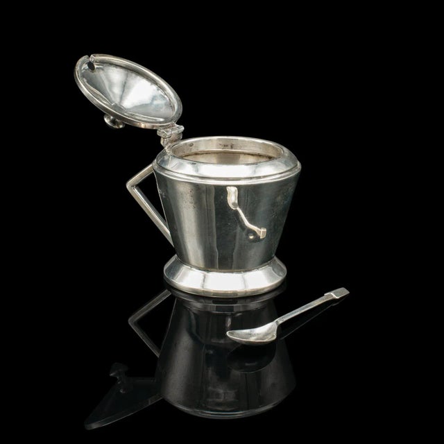 This is a vintage condiment set. An English, Sterling Silver salt & pepper shaker and mustard pot in Art Deco taste,...