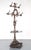 Victorian style hall tree made of cast iron with a coat of clear sealant. It features eight double arm hooks, a removable...