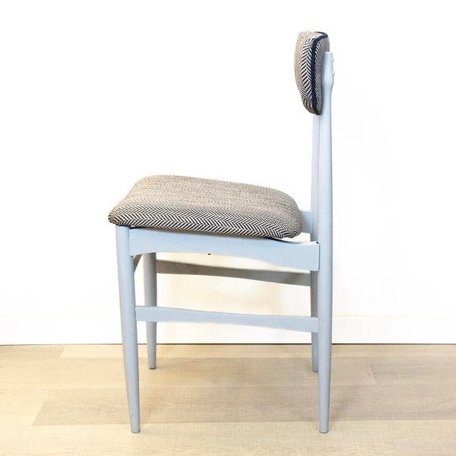 Mid Century wooden chairs from the 60s, painted in gray and upholstered in herringbone fabric in gray and black tones.