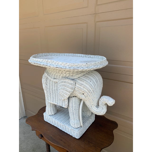 A charming Mid-Century wicker rattan white elephant garden stool or side table with removable tray top USA, Circa 1970s...
