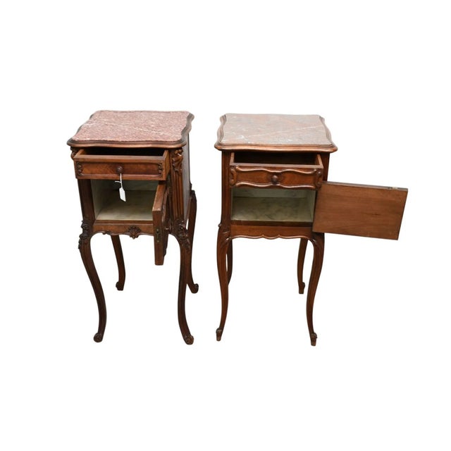 The product is a pair of antique French nightstands with marble tops, featuring a similar design. They are fully assembled...