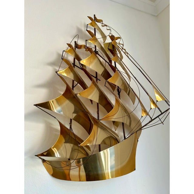 This vintage 1970's John Demott tall sailing ship is handcrafted from brass and ready to hang. It is signed and has the...