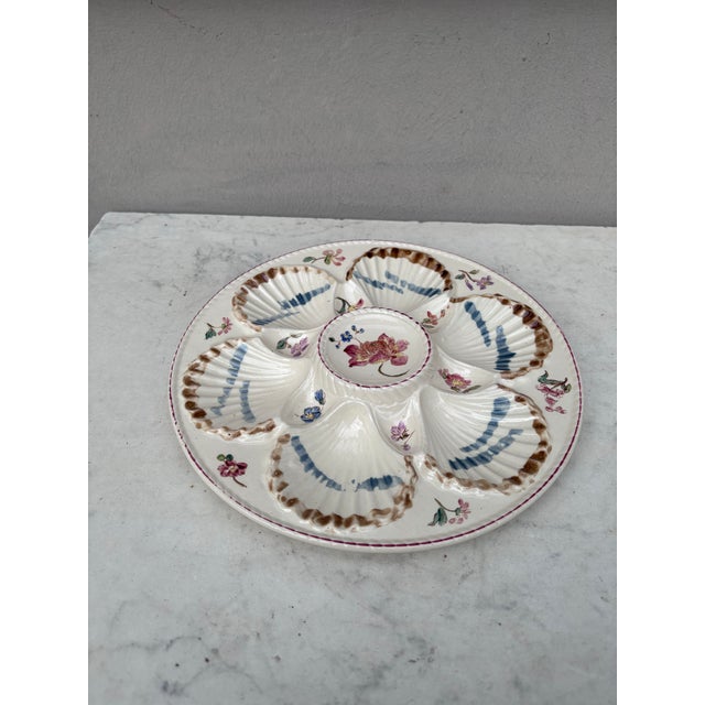French Majolica oyster plate with flowers circa 1890 signed Longchamp.