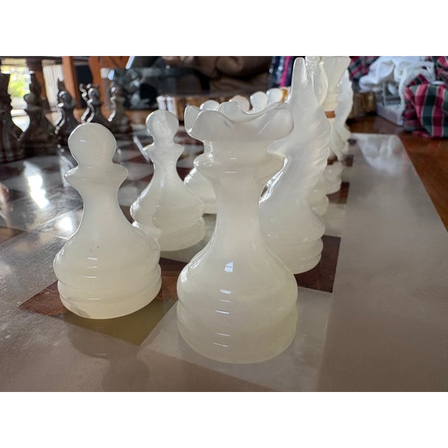 Striking vintage hand-carved natural stone chess set attributed to Mexico, dating to approximately the 1960s–1970s. This...