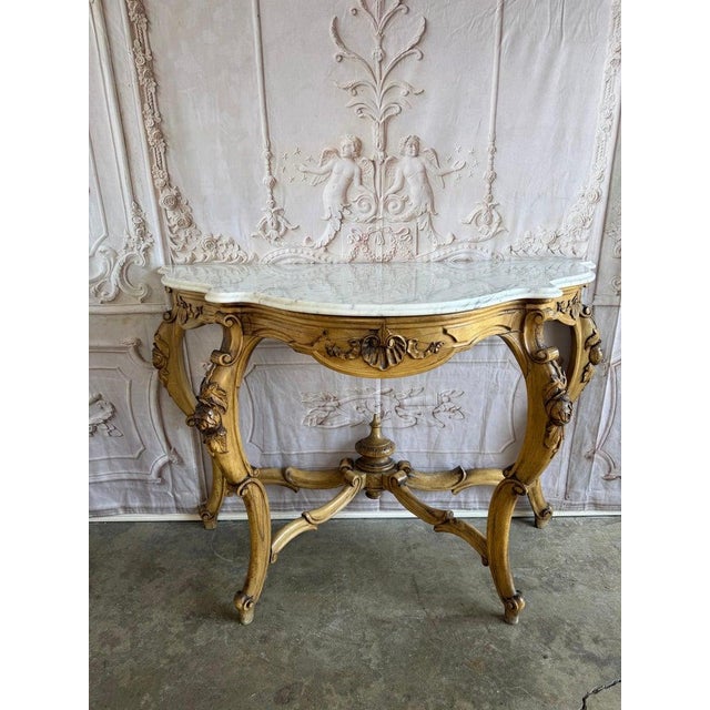 Elegant 19th-century French Louis XV style demi-lune console table, circa 1860-1880. The carved wood frame features...