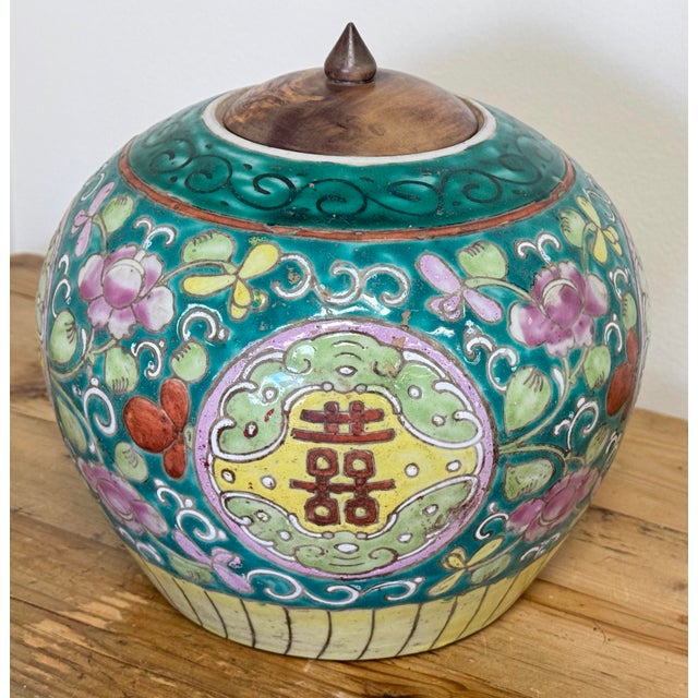 Antique 19th C Double Happiness ginger jar glazed in vibrant green, yellow, pink and red enamels. Original wood lid topped...