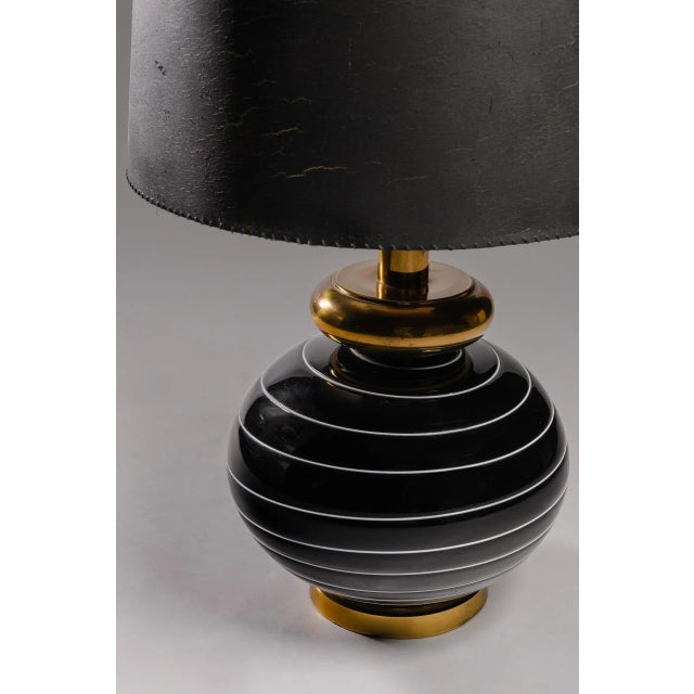 Monumental table lamp in black glass, with withe spyral detail and brass. The lamp was handcrafted in the late 1970 in...