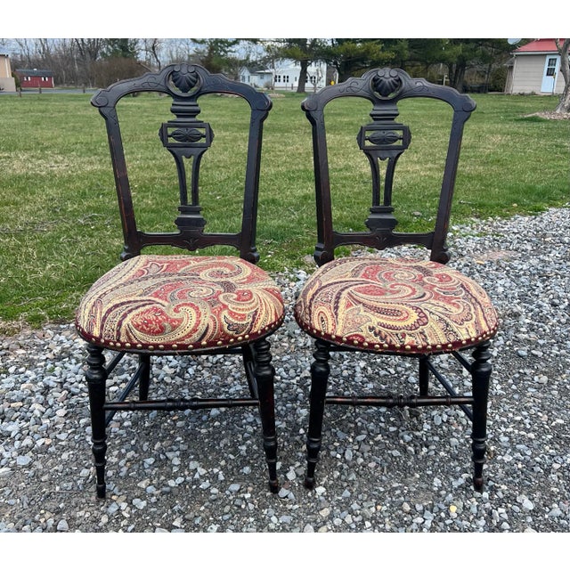 Antique east lake style carved chairs circa 1890. Signature east lake carvings with turned legs , original finish. The...